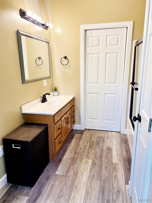 885 Oak Pass Ln, Sullivan, MO 63080 - full bathroom featuring vanity and wood finished floors