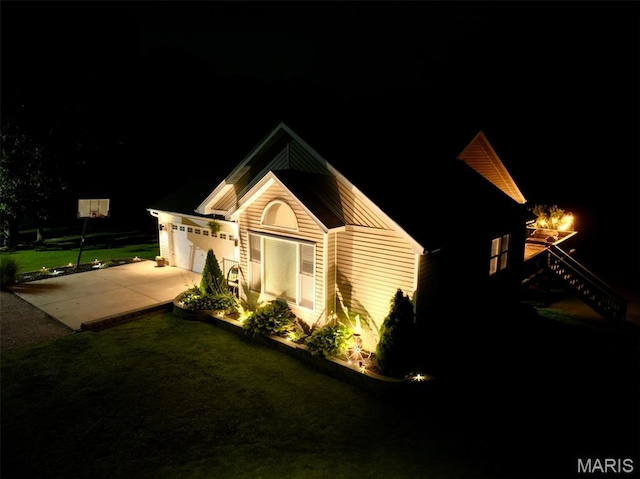 885 Oak Pass Ln, Sullivan, MO 63080 - property exterior at twilight with concrete driveway and an attached garage