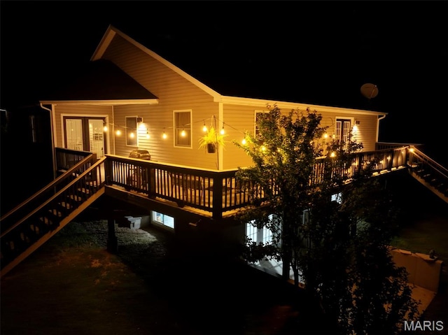 885 Oak Pass Ln, Sullivan, MO 63080 - back of house at night with stairway and a wooden deck