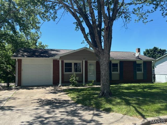 537 Crestwood Dr, Jackson, MO 63755 - ranch-style home featuring brick siding, a garage, a front yard, driveway, and a chimney