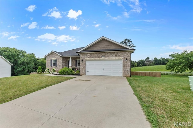255 Sassenach Dr, Jackson, MO 63755 - craftsman house with concrete driveway, an attached garage, brick siding, and a front lawn
