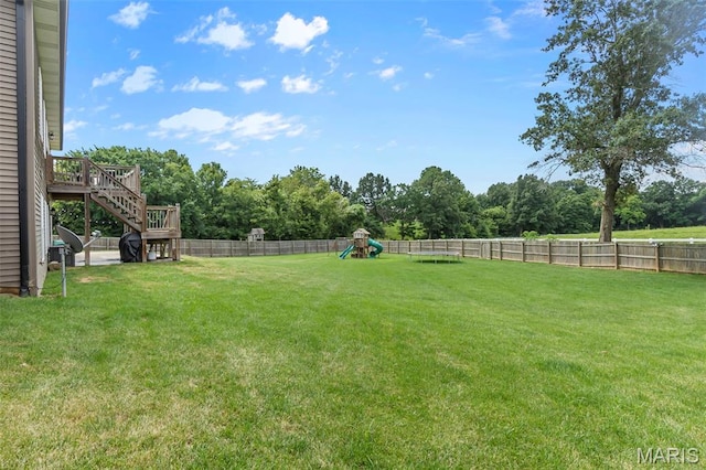 255 Sassenach Dr, Jackson, MO 63755 - fenced backyard featuring a playground, stairs, and a wooden deck