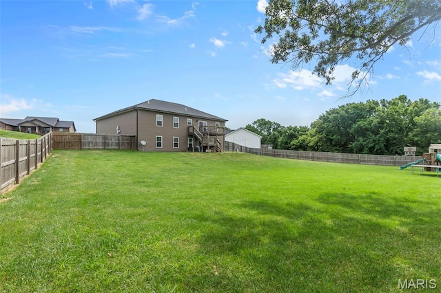 255 Sassenach Dr, Jackson, MO 63755 - fenced backyard featuring a playground, stairway, and a wooden deck