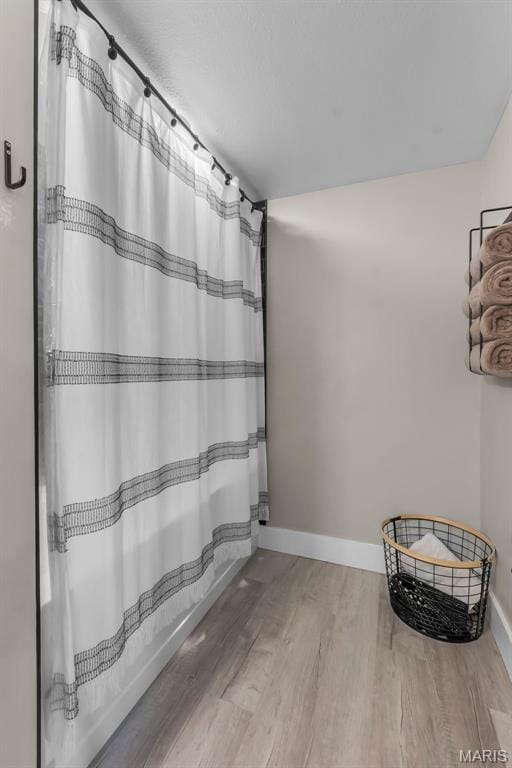 255 Sassenach Dr, Jackson, MO 63755 - full bath with wood finished floors and shower / tub combo