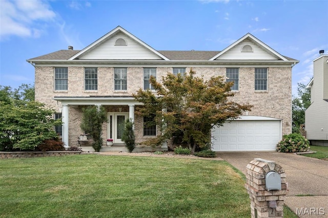 2849 Dardenne Links Dr, Dardenne Prairie, MO 63368 - traditional-style home with brick siding, concrete driveway, a front lawn, and a garage