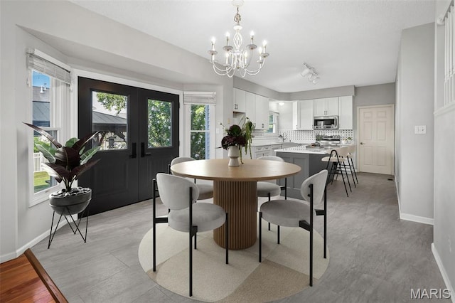 2849 Dardenne Links Dr, Dardenne Prairie, MO 63368 - dining room with a chandelier and plenty of natural light