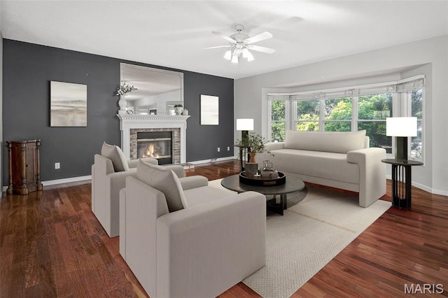 2849 Dardenne Links Dr, Dardenne Prairie, MO 63368 - living room featuring a ceiling fan, wood finished floors, and a glass covered fireplace