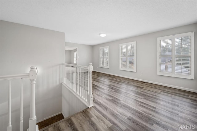 2849 Dardenne Links Dr, Dardenne Prairie, MO 63368 - spare room with healthy amount of natural light and wood finished floors
