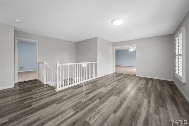 2849 Dardenne Links Dr, Dardenne Prairie, MO 63368 - unfurnished room with wood finished floors, a smoke detector, and a ceiling fan
