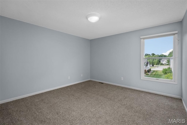 2849 Dardenne Links Dr, Dardenne Prairie, MO 63368 - carpeted empty room with a textured ceiling and baseboards