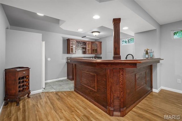 2849 Dardenne Links Dr, Dardenne Prairie, MO 63368 - indoor wet bar featuring light wood-style flooring, decorative columns, and recessed lighting