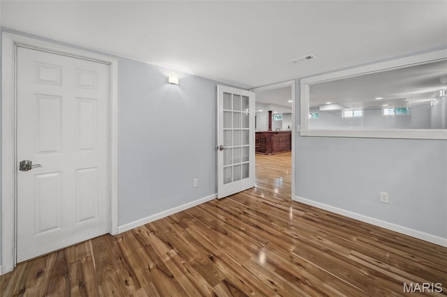 2849 Dardenne Links Dr, Dardenne Prairie, MO 63368 - spare room featuring wood finished floors and french doors