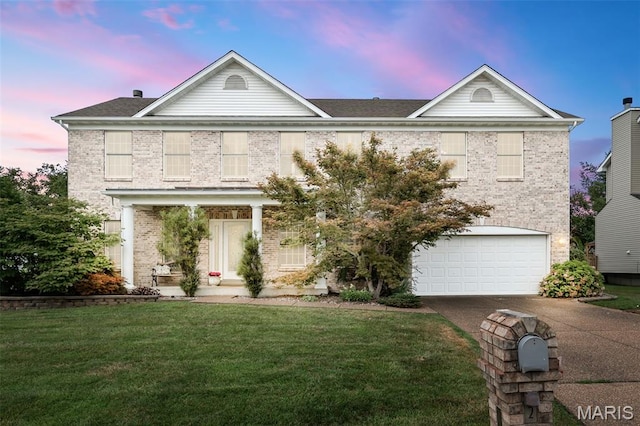 2849 Dardenne Links Dr, Dardenne Prairie, MO 63368 - traditional home featuring brick siding, concrete driveway, an attached garage, and a front lawn