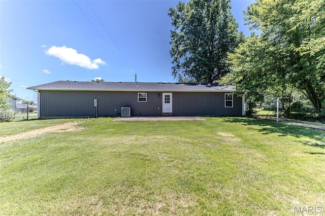 1507 Finn Dr, Lebanon, MO 65536 - back of house with a patio area and a lawn