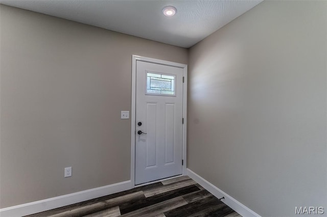 1507 Finn Dr, Lebanon, MO 65536 - doorway to outside with baseboards and dark wood-type flooring
