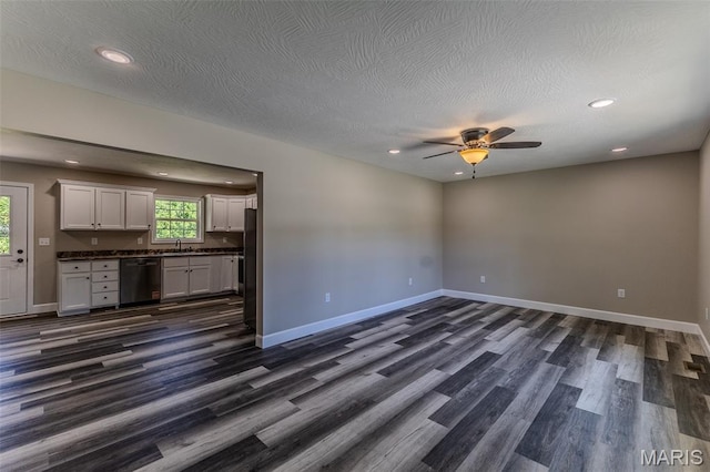 1507 Finn Dr, Lebanon, MO 65536 - unfurnished living room with dark wood-style floors, a ceiling fan, recessed lighting, and a textured ceiling