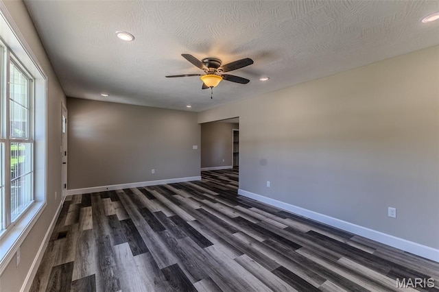1507 Finn Dr, Lebanon, MO 65536 - empty room with dark wood-type flooring, healthy amount of natural light, ceiling fan, and recessed lighting