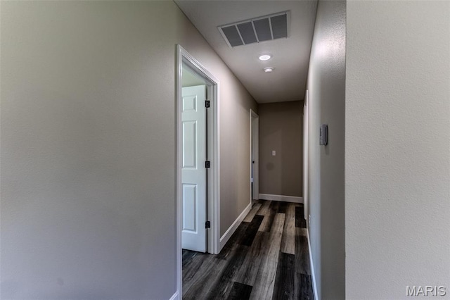1507 Finn Dr, Lebanon, MO 65536 - hallway with dark wood-style floors and baseboards
