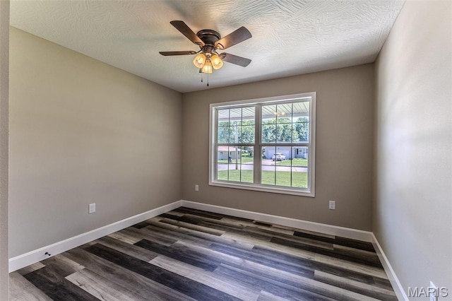 1507 Finn Dr, Lebanon, MO 65536 - empty room featuring ceiling fan and dark wood-type flooring