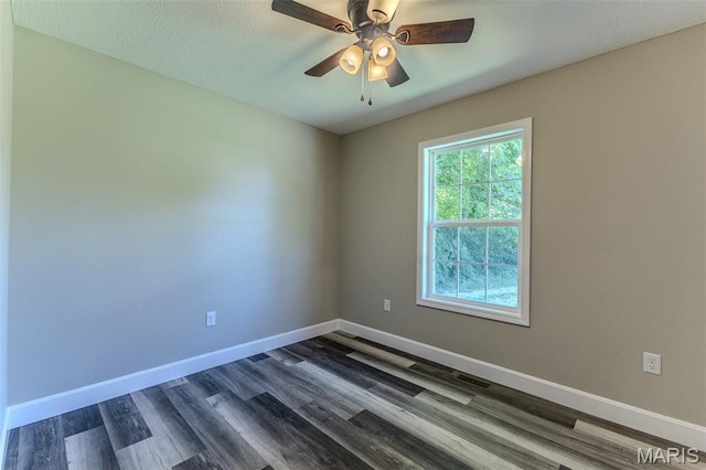 1507 Finn Dr, Lebanon, MO 65536 - empty room featuring dark wood-style floors and a ceiling fan