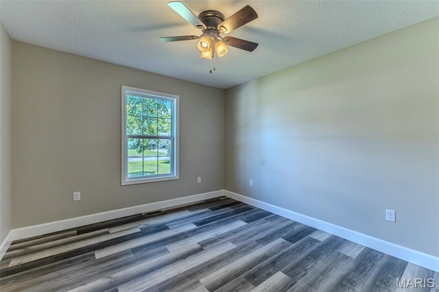 1507 Finn Dr, Lebanon, MO 65536 - unfurnished room with dark wood finished floors, a ceiling fan, and a textured ceiling