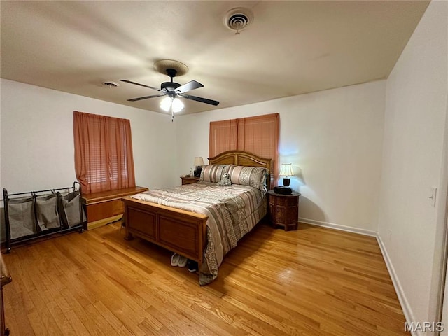 918 E 7th St, Rolla, MO 65401 - bedroom with light wood finished floors and ceiling fan