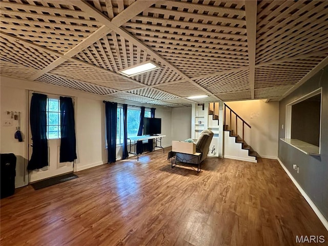 918 E 7th St, Rolla, MO 65401 - unfurnished living room with wood finished floors and stairway