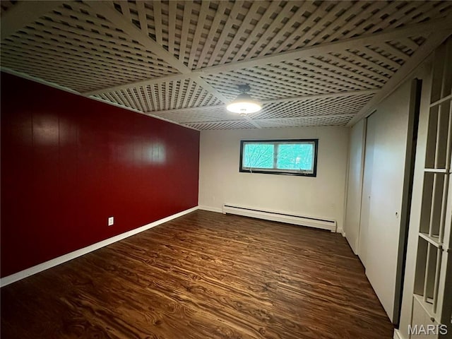 918 E 7th St, Rolla, MO 65401 - empty room with baseboard heating and wood finished floors