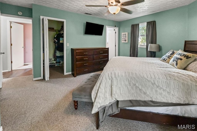 1716 Fountainbleu Dr, Worden, IL 62097 - bedroom featuring a textured ceiling, carpet, and ceiling fan