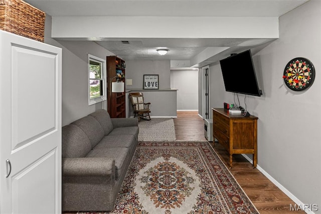 1716 Fountainbleu Dr, Worden, IL 62097 - living area featuring dark wood finished floors and baseboards
