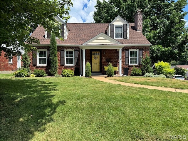 35 Holly Dr, Webster Groves, MO 63119 - cape cod-style house featuring a front lawn, a chimney, brick siding, and roof with shingles