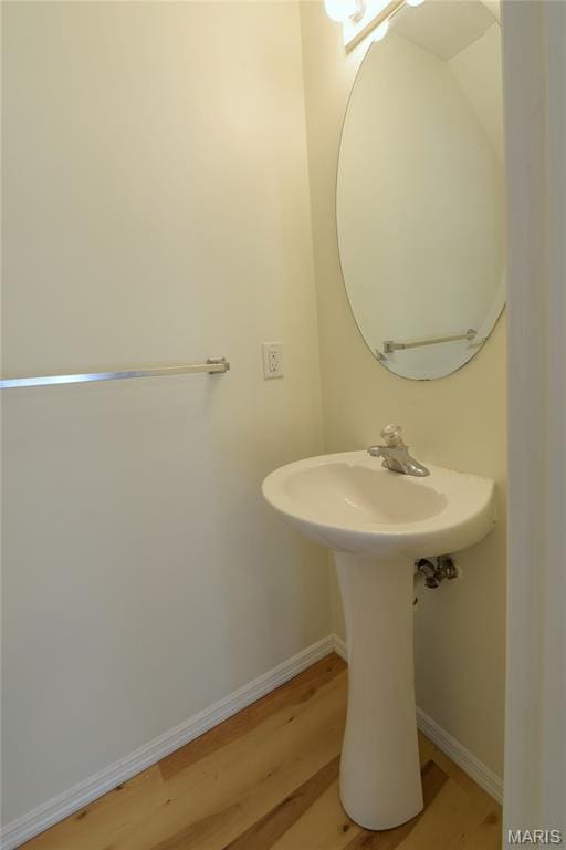 154 Homeshire Dr Unit 27, Wentzville, MO 63385 - bathroom featuring wood finished floors and baseboards