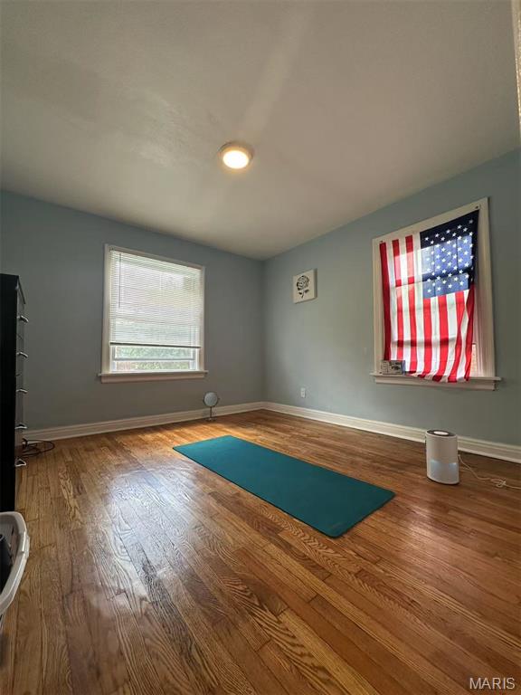 3525 Belaire Pl, Beverly Hills, MO 63121 - empty room featuring wood finished floors and baseboards