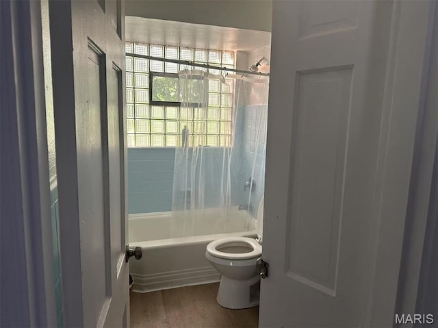 3525 Belaire Pl, Beverly Hills, MO 63121 - full bathroom featuring  shower combination and wood finished floors