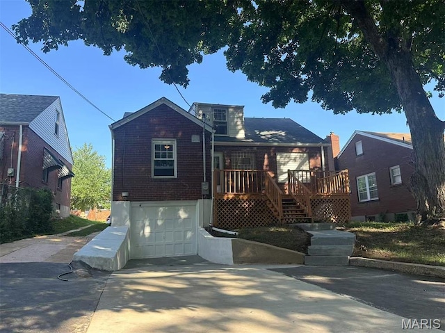 3525 Belaire Pl, Beverly Hills, MO 63121 - bungalow-style house with brick siding, a garage, a deck, and concrete driveway