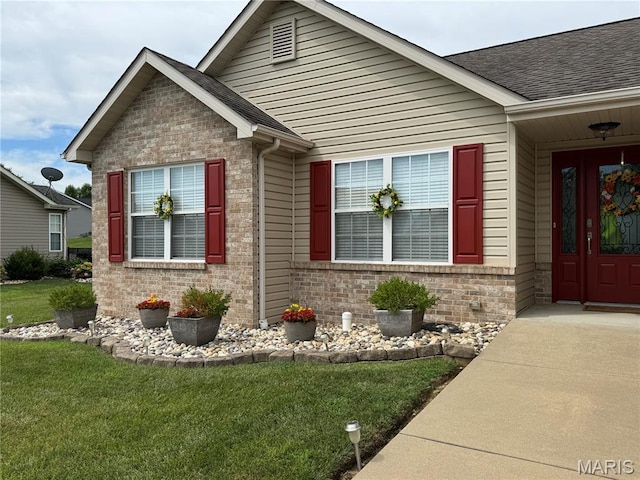 5037 Bristol Hill Dr, Ofallon, IL 62269 - entrance to property featuring brick siding, a yard, and a shingled roof