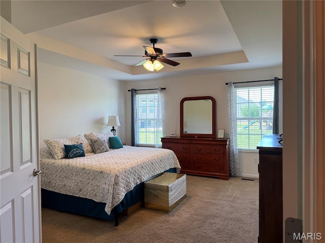 5037 Bristol Hill Dr, Ofallon, IL 62269 - bedroom featuring a raised ceiling, light carpet, and ceiling fan