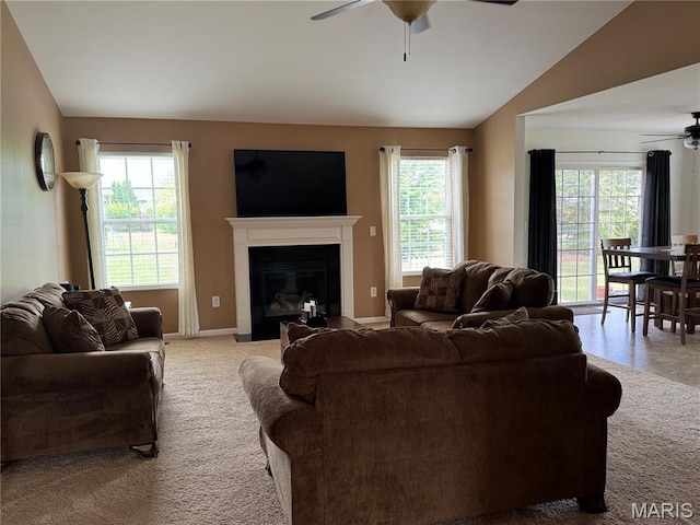 5037 Bristol Hill Dr, Ofallon, IL 62269 - living room featuring a ceiling fan, plenty of natural light, a fireplace with flush hearth, light colored carpet, and lofted ceiling
