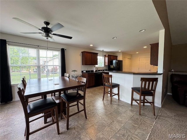 5037 Bristol Hill Dr, Ofallon, IL 62269 - dining space featuring a ceiling fan, recessed lighting, and light stone finish floors