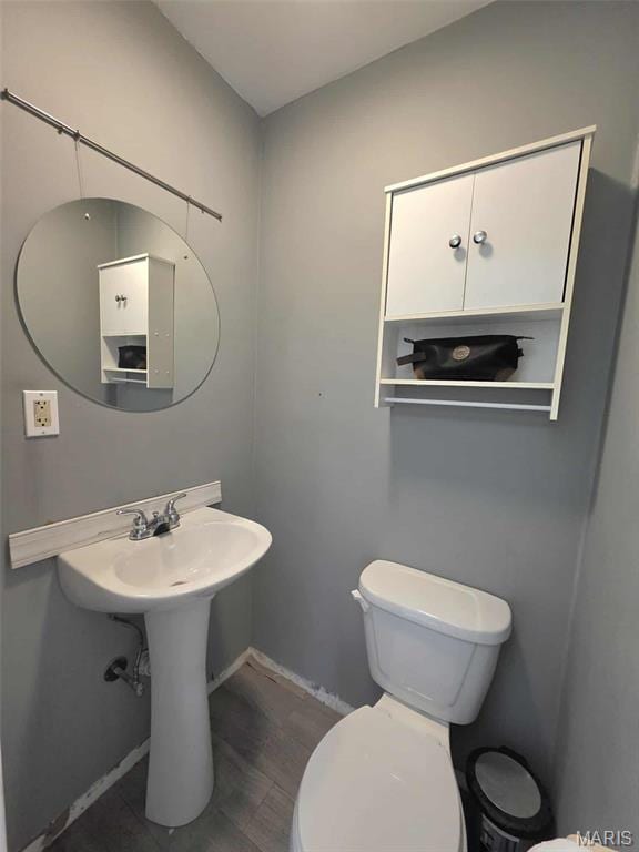 315 W State St, Union, MO 63084 - bathroom featuring toilet and wood finished floors