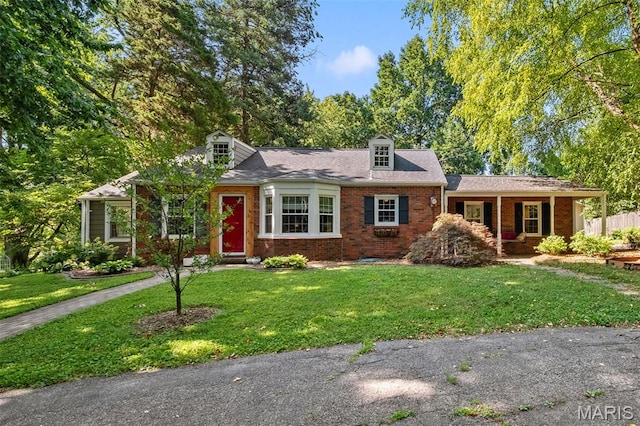 100 Calverton Rd, Saint Louis, MO 63135 - cape cod-style house featuring a front yard, brick siding, and a porch