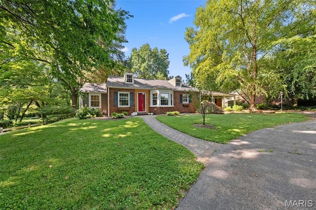 100 Calverton Rd, Saint Louis, MO 63135 - view of front of house featuring brick siding and a front yard