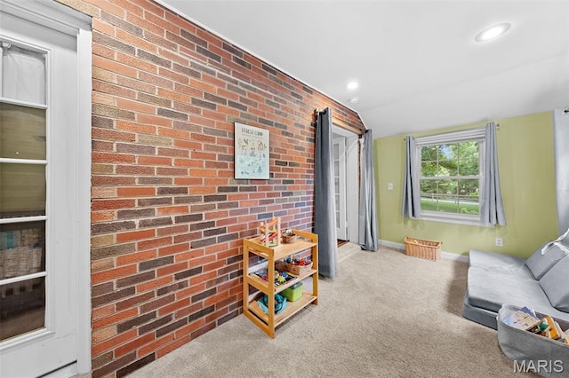 100 Calverton Rd, Saint Louis, MO 63135 - carpeted living area featuring brick wall and recessed lighting