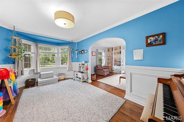 100 Calverton Rd, Saint Louis, MO 63135 - recreation room with crown molding, arched walkways, wainscoting, and wood finished floors