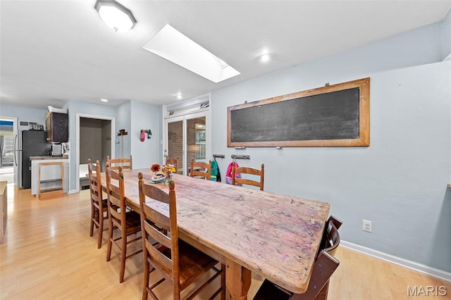 100 Calverton Rd, Saint Louis, MO 63135 - dining space featuring a skylight, light wood-type flooring, and recessed lighting