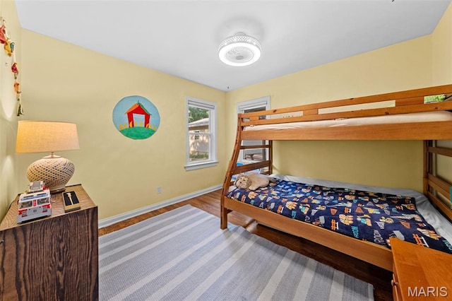 100 Calverton Rd, Saint Louis, MO 63135 - bedroom featuring baseboards and wood finished floors