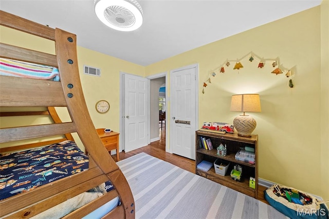 100 Calverton Rd, Saint Louis, MO 63135 - bedroom with wood finished floors and baseboards