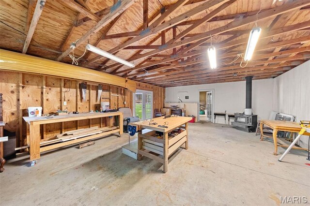 100 Calverton Rd, Saint Louis, MO 63135 - below grade area featuring a workshop area and a wood stove