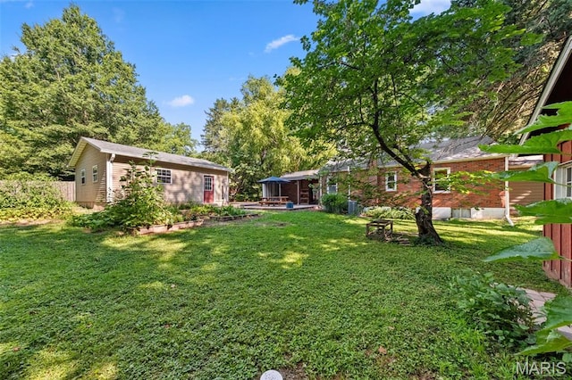 100 Calverton Rd, Saint Louis, MO 63135 - view of yard with an outdoor structure and a patio