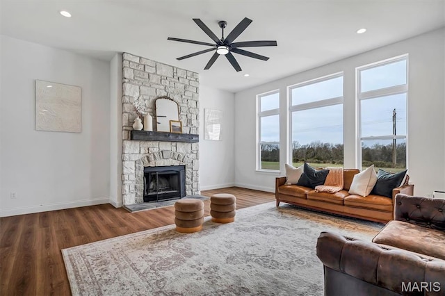 213 Bluegrass Pasture Ct, Wentzville, MO 63385 - living room featuring a ceiling fan, wood finished floors, a fireplace, and recessed lighting